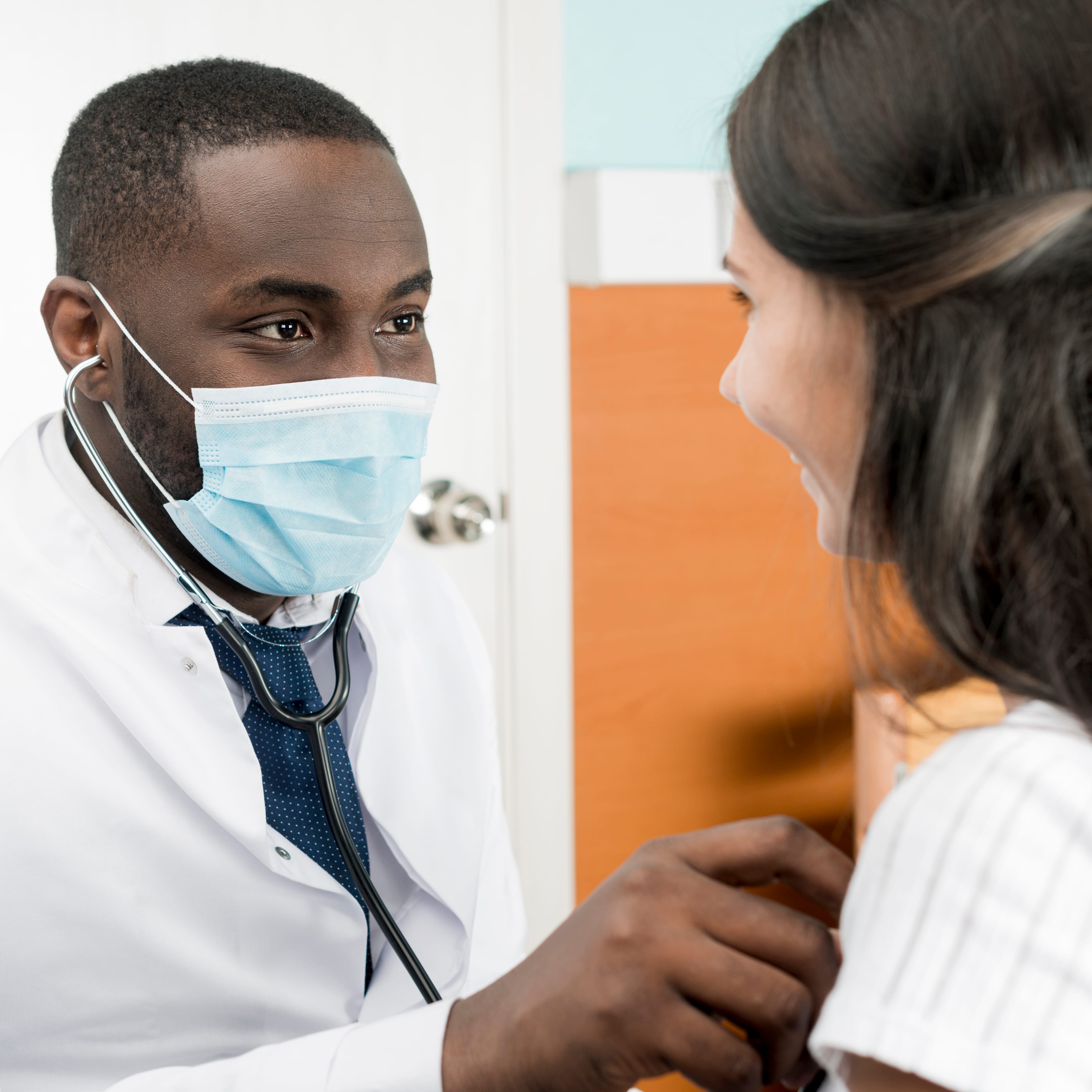 A clinician finalising notes at the end of a consultation.